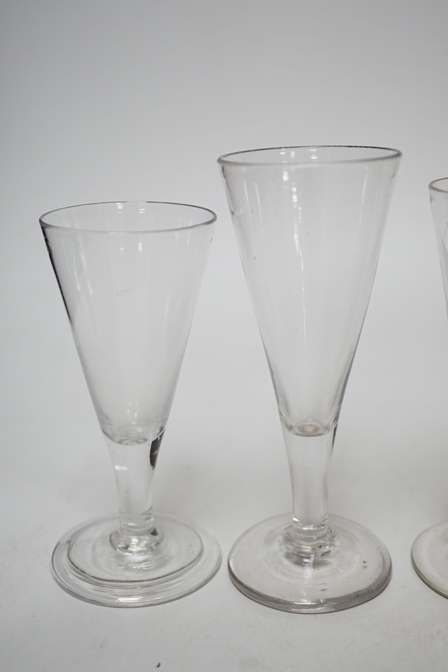 Six Georgian ale glasses, four with wheel engraved bowls. Tallest 15cm